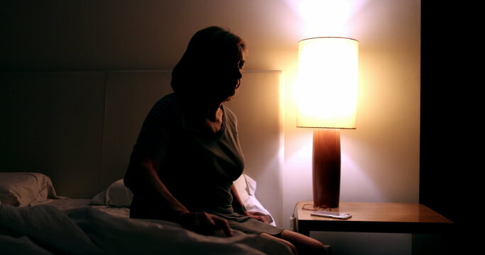 Troubled Senior Unable To Sleep. Anxious Older Woman Awake In The Middle Of The Night Suffering