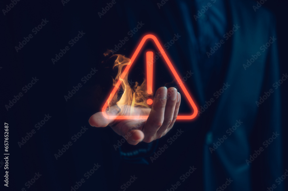 Aufkleber hand showing red triangle caution warning sign for maintenance notification error and risk concept, 