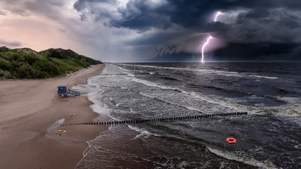 Fototapeten Lifeguard tower flooded during lightning storm at Baltic Sea, Poland © shaiith
