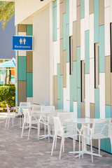 Public restrooms with tables and chairs by restaurant