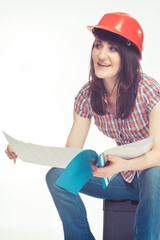 Woman engineer in red helmet with documents, project or plans. Engineering