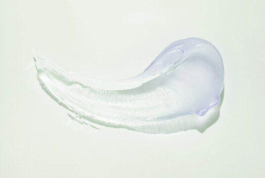 Liquid blue cosmetic gel or vaseline smudge texture on light gray background - Powered by Adobe