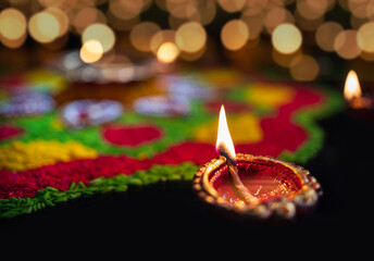 Clay diya lamps lit during diwali celebration, Diwali, or Deepavali, is India's biggest and most...