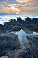 Sun Setting over the Bay of Malia near Sissi, Crete, Greece.