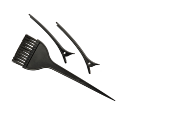 Hair dye brush, black hair clips. Isolated background.