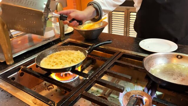 Fast food establishment. A very dirty kitchen where spaghetti is cooked on the stove. Cooking pasta in a dirty establishment