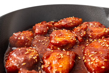 Monkfish bulgogi on a white background