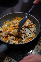 Closeup of delicious vegetables and mushrooms on a pan. Cooking healthy food.