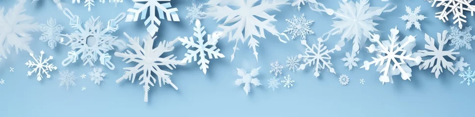 Fotobehang A blue background with white snowflakes © pham