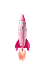 Obraz premium Launch of a pink toy rocket, successful start, isolated white background