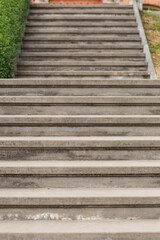 an old staircase made of gray stone leads upstairs 