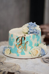 The wedding cake is decorated with flowers. Preparation for the wedding celebration.