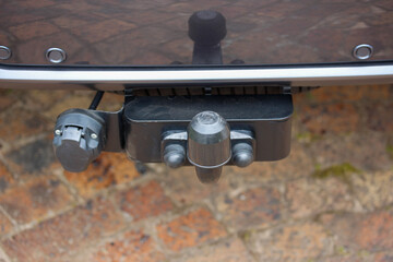 Close up of a large SUV tow hitch with plug