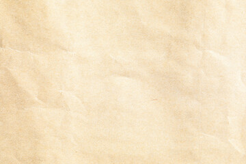 Brown crumpled paper texture with grains macro closeup