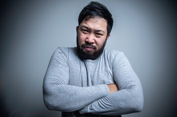 Fototapeta premium Asian handsome man angry on white background,Portrait of young Stress male concept,Bad mood after talking on the phone