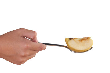 hand holding a spoon with slice of apple 