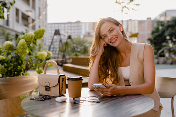 Fototapeta na wymiar woman sitting in cafe with phone