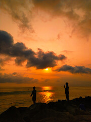 silhouette of a couple at sunset
