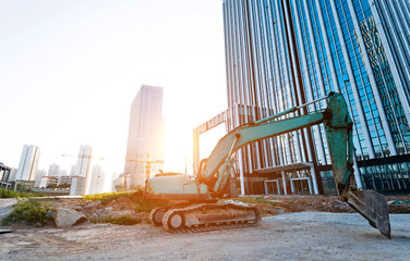 Excavator on construction site office building