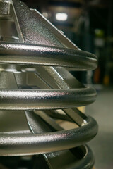 close up of a stack of steel steering wheels