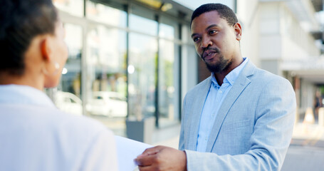 Consulting, insurance and businessman or salesman talking to a client about a deal in a city....