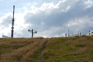 The Krížava radio and television transmitter and pole of a ski lift which is out of service in...