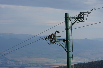  Pole of a ski lift out of service in summer in Little Fatra in Slovakia close up. On the...