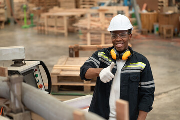 Portrait technician craft man African American man use monitor control  machine and timber background at wood factory	