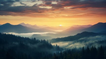A stunning scene of the misty and vibrant sunset sky above a pine forest and a range of mountains during a cloudy evening.