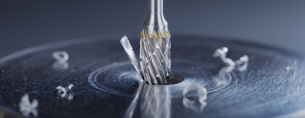 Milling cutter make sink in hole in steel billet. Locksmith work.
