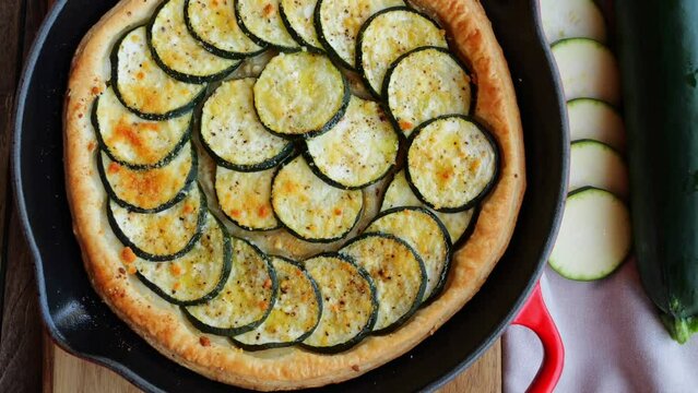Zucchini pie tart puff pastry and cheese, cooking baked. Top view. Close up