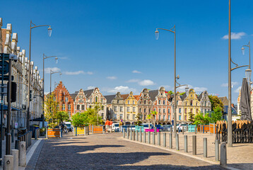 Arras cityscape with Flemish-Baroque-style townhouses buildings on La Grand Place square in old town center, blue sky in summer day, Pas-de-Calais department, Hauts-de-France Region, Northern France - obrazy, fototapety, plakaty