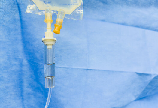 hospital IV drip, with translucent tubing and liquid medication flowing, symbolizing medical care, treatment, and health support