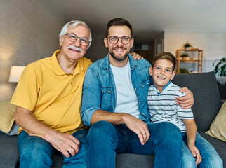child family portrait man father grandfather son group male boy smiling happy adult grandparent...