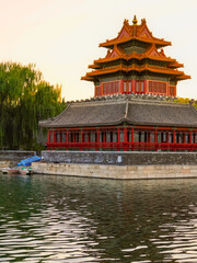 View of the Forbidden City with the reflection on the moat at sunset in Beijing, China. - 657836646