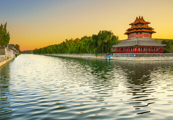 View of the Forbidden City with the reflection on the moat at sunset in Beijing, China. - 657836653