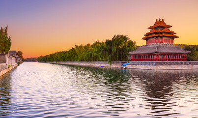 View of the Forbidden City with the reflection on the moat at sunset in Beijing, China. - 657836692