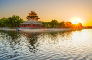 View of the Forbidden City with the reflection on the moat at sunset in Beijing, China. - 657836694