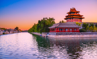 View of the Forbidden City with the reflection on the moat at sunset in Beijing, China. - 657836819