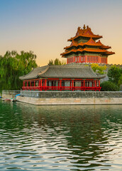 View of the Forbidden City with the reflection on the moat at sunset in Beijing, China. - 657836850