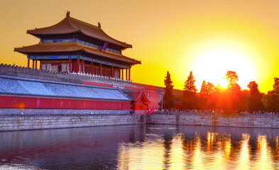 View of the Forbidden City with the reflection on the moat at sunset in Beijing, China. - 657836852