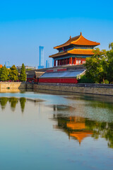 View of the Forbidden City with the reflection on the moat on a sunny day in Beijing, China. - 657837075