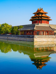 View of the Forbidden City with the reflection on the moat on a sunny day in Beijing, China. - 657837419
