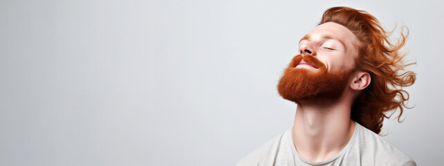 Men's Grooming Mastery: Studio Shots of a Muscular Ginger Man with Windy Hair and Beard with Copy-Space - obrazy, fototapety, plakaty