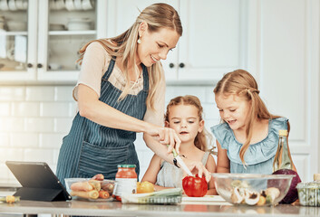Happy woman in kitchen, cooking together with kids and teaching, learning and nutrition with...