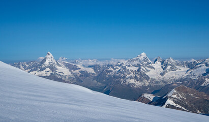 Saas-Fee, Switzerland - June 16th 2023: Panoramic view during a early-morning glacier descent 