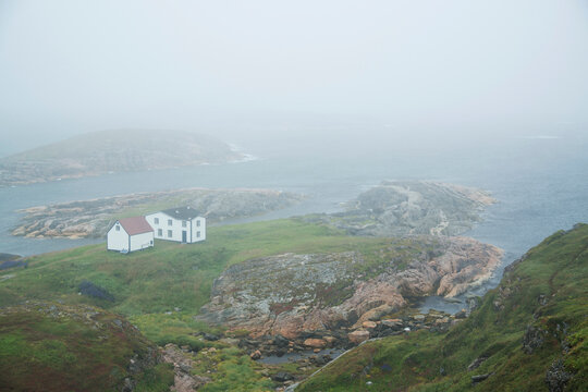 House on a point at the fishing outpost of Battle Harbour on the Atlantic coast of Canada; Battle Harbour, Newfoundland and Labrador, Canada