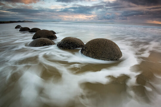 Long exposure of the Moeraki Boulders along Koekohe Beach on the South Island of New Zealand; Hampden, North Otago, New Zealand