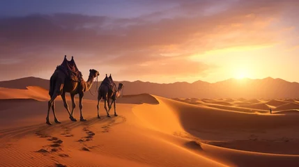 Foto auf Leinwand a serene desert landscape with a caravan of camels making their way across the golden dunes at dawn © Shahzaib