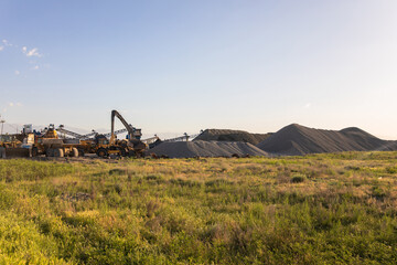 Fototapeta premium Heavy equipment works at a sand processing quarry